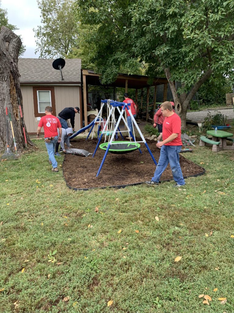 The image shows BHC and PARIC Corporation's volunteers and home improvements made during the 2023 Christmas In October event.